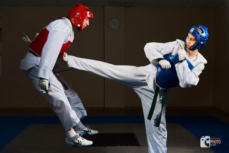 two athletes practice sparring